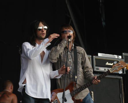 Mani with Bobby Gillespie on stage.